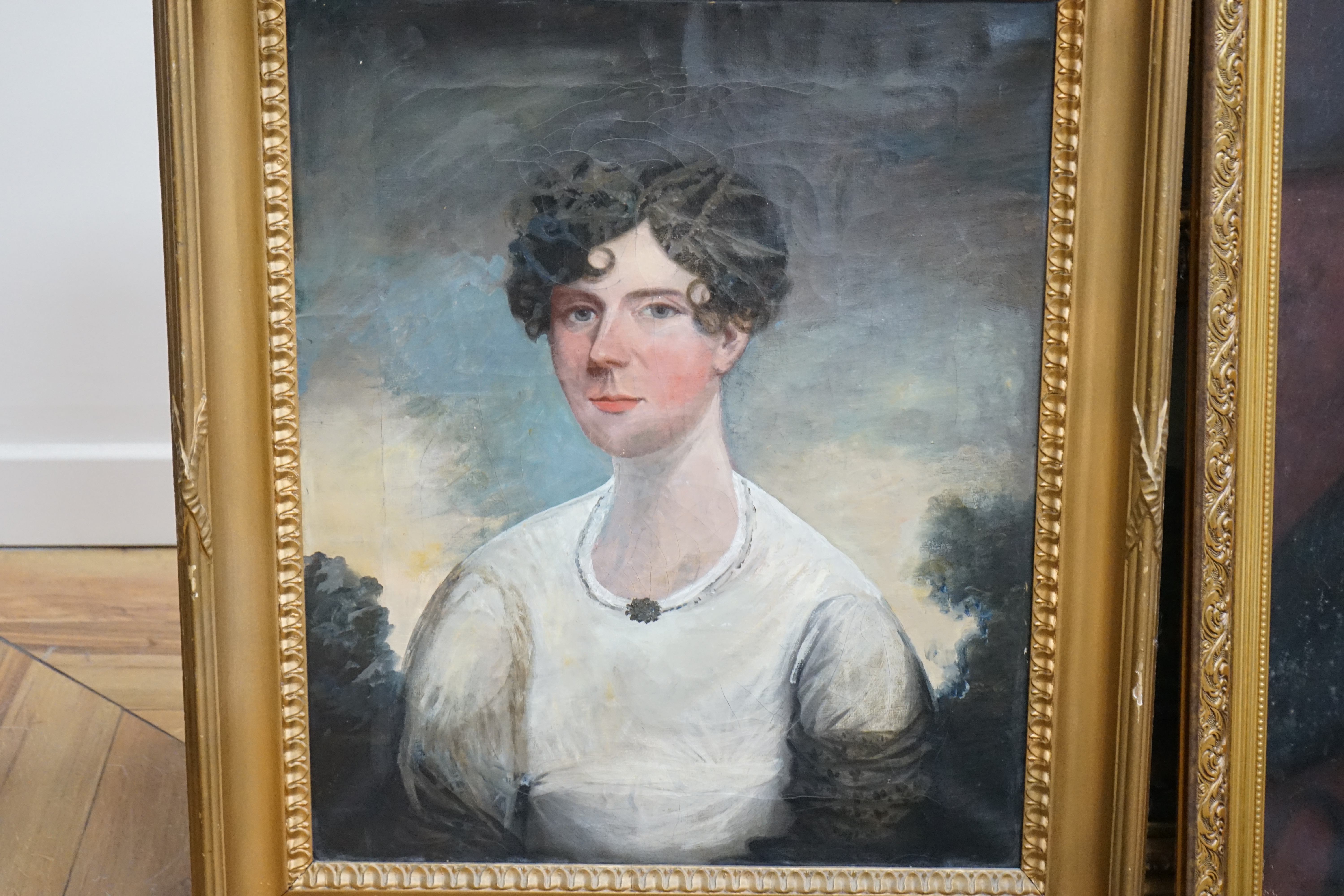 Two 19th century oils on canvas, comprising Regency naive School, portrait of a young lady and a mid 19th century School, portrait of a lady in mourning, largest 90 x 70cm. Condition - poor